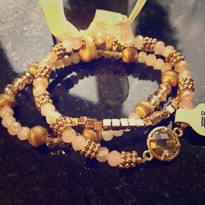 Francesca’s gold and ivory elastic bracelet